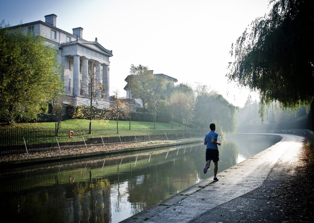 Man running at canalside