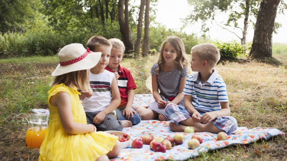 kids sat in circle having picnic